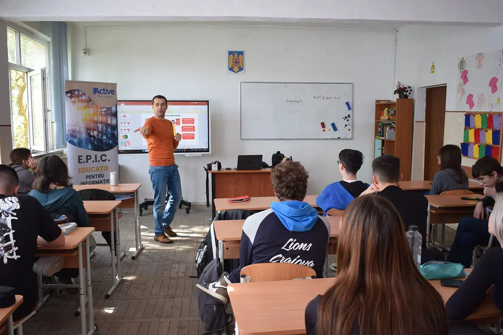 Students taking part in an interactive media literacy workshop at a high school in Dolj county